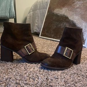 Korks suede brown booties with gold buckle.